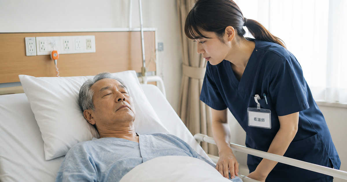Nurse in navy scrubs leans over a hospital bed to check on an elderly man who is sleeping, badge visible at her chest.